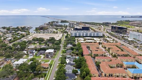 An aerial view shows a residential neighborhood near a large body of water — 5207 W CLEVELAND STREET, TAMPA, FL