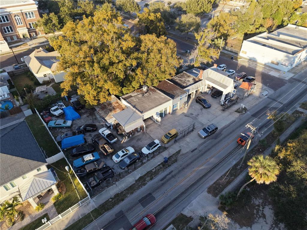 An aerial view shows a commercial building with a parking lot filled with various vehicles — 201 W COLUMBUS DRIVE, TAMPA, FL