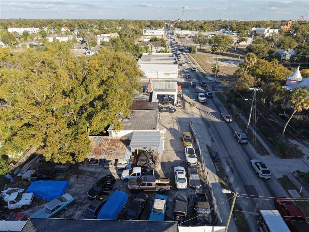 An aerial view shows a commercial property with a parking lot and surrounding buildings — 201 W COLUMBUS DRIVE, TAMPA, FL