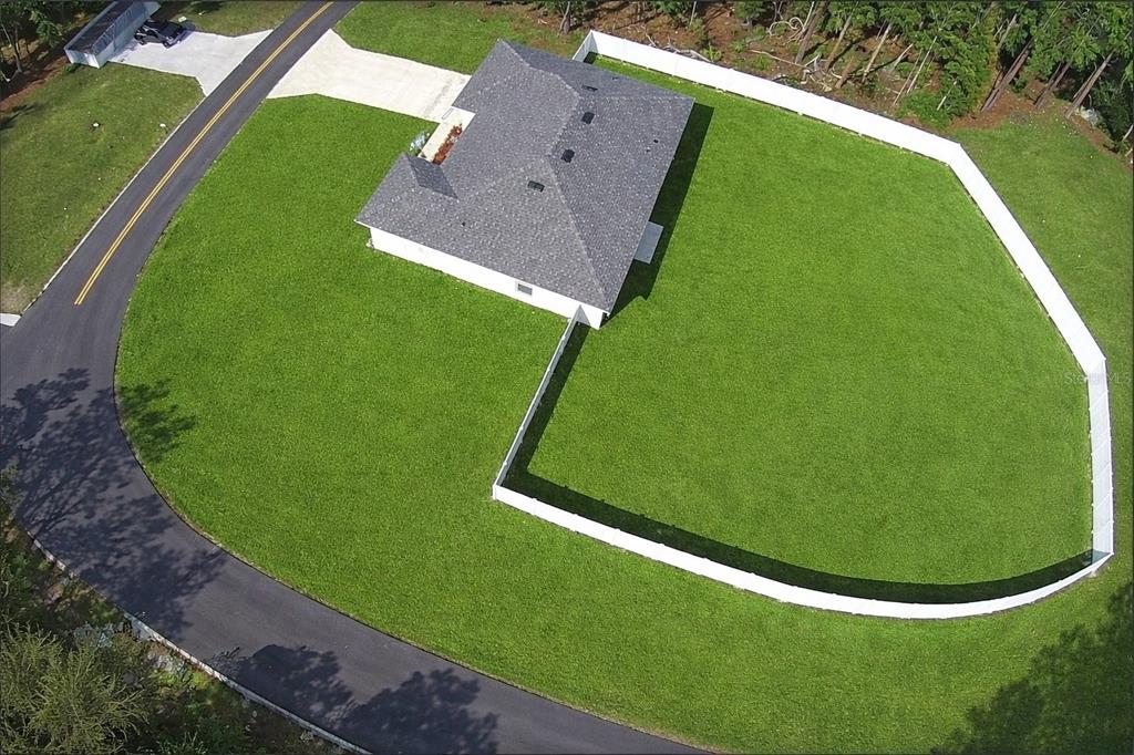 An aerial view shows a house with a gray roof and a large fenced backyard — 6365 SW 156TH STREET, OCALA, FL