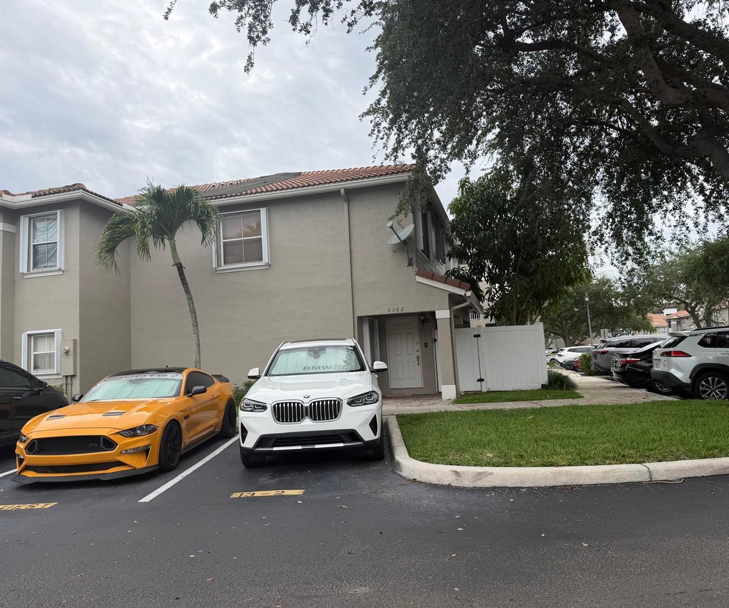 A two-story residential building with a yellow sports car and white SUV parked outside — 5362 SW 125th Avenue, Miramar FL 33027, MIRAMAR, FL