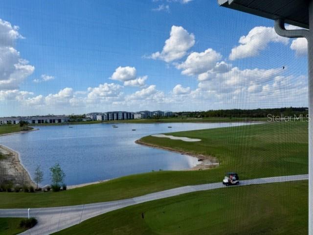 A view of a lake and golf course from a screened-in balcony — 12140 WELLEN GOLF STREET UNIT 402, VENICE, FL