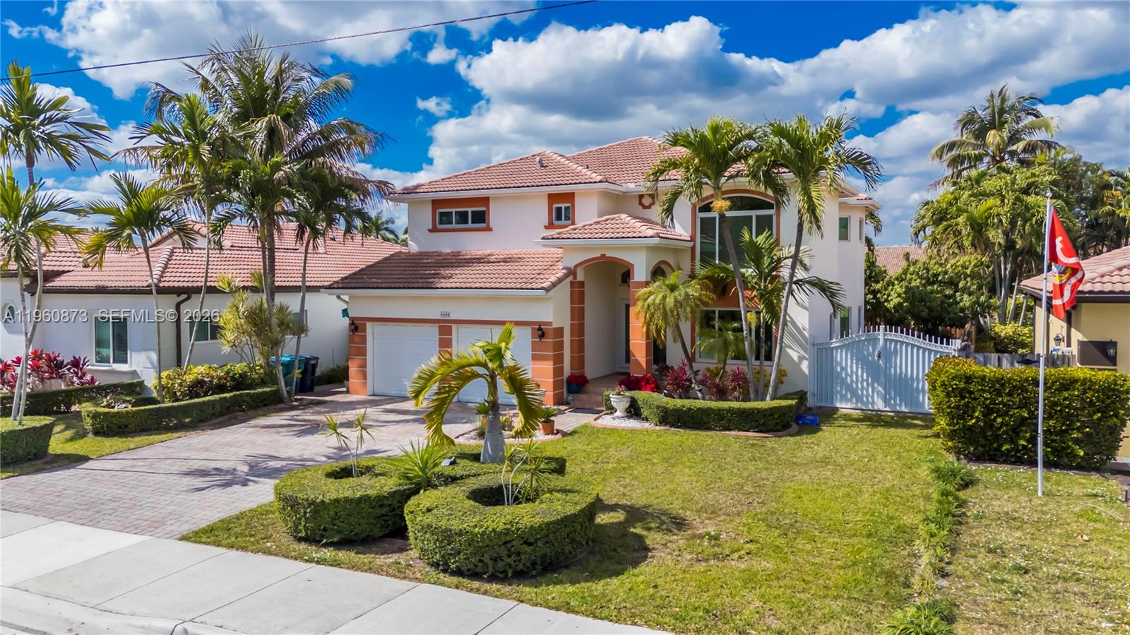 A two-story stucco house with a tile roof, palm trees, and a landscaped front yard — 2680 SW 142nd Ave, Miami FL 33175, MIAMI, FL
