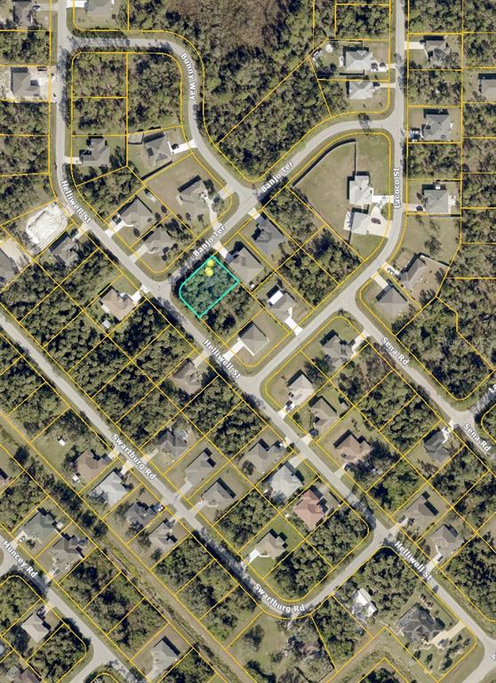 This is an aerial map showing a vacant residential lot highlighted in a suburban neighborhood — BANJO TERRACE, NORTH PORT, FL