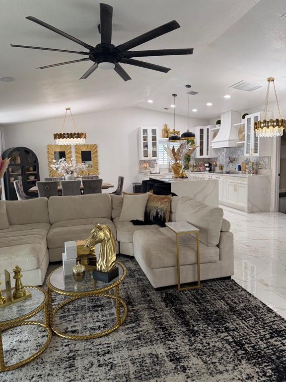 A front entryway features double glass doors, two topiary planters, and a welcome mat — 1241 ANGELINE AVENUE, ORLANDO, FL