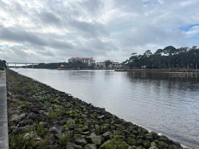 A view of a river with a rocky shoreline and a bridge in the distance — 244 YACHT HARBOR DRIVE, PALM COAST, FL