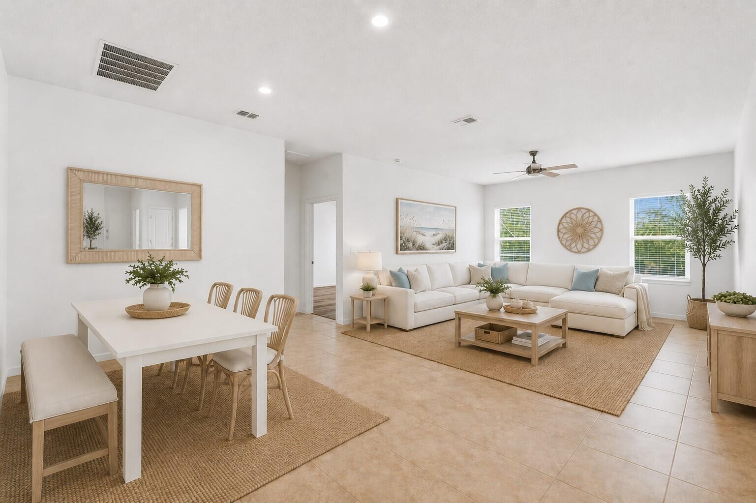 An open-concept living and dining area features white walls, tile flooring, and neutral furnishings — 4213 Keeson Circle, Vero Beach FL 32967, VERO BEACH, FL