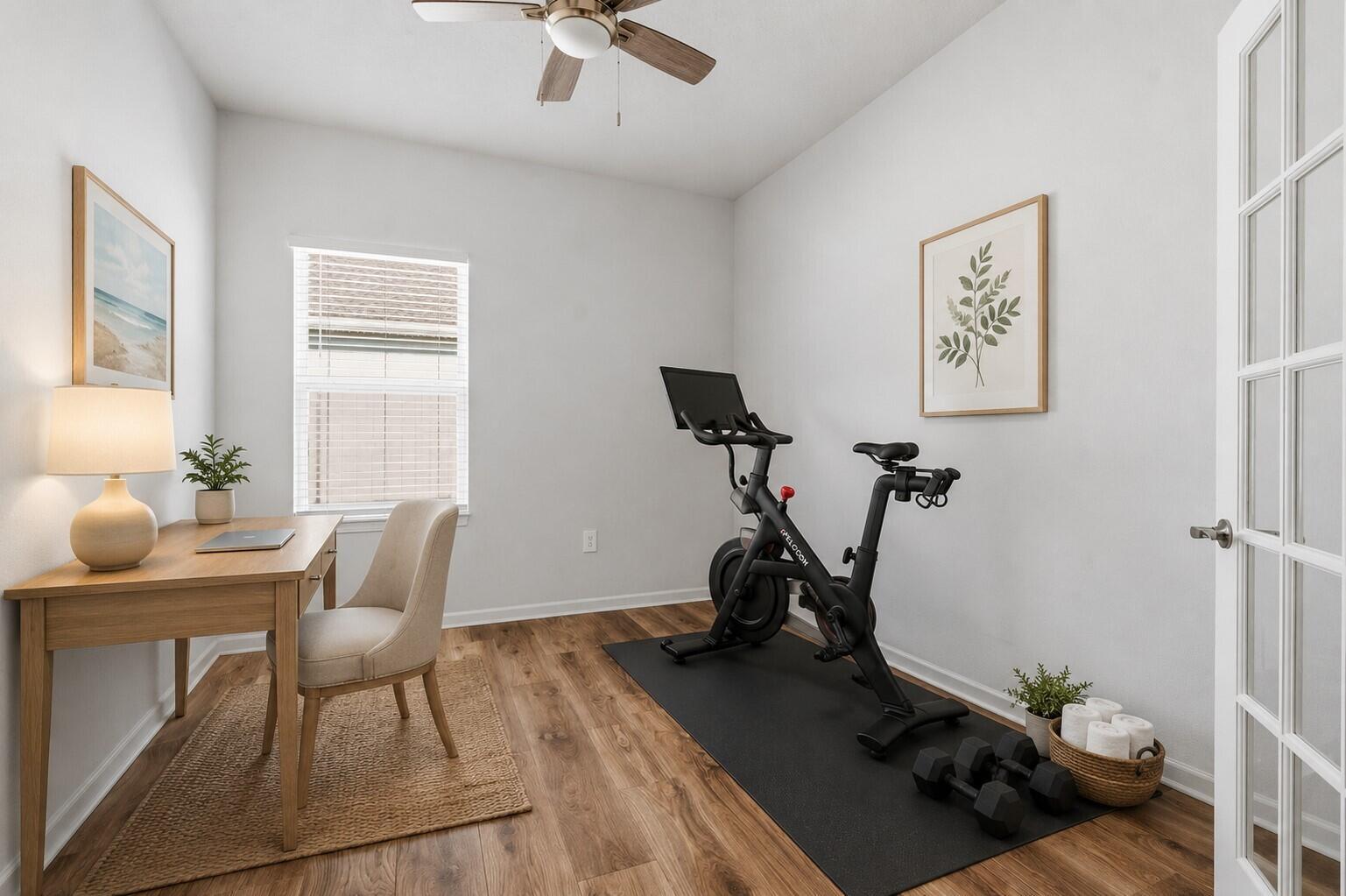 A home office and gym combination room with a desk, chair, and stationary bike — 4213 Keeson Circle, Vero Beach FL 32967, VERO BEACH, FL