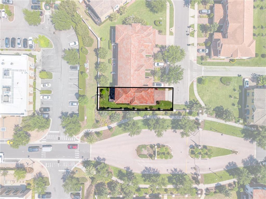 This aerial view shows a residential building with a highlighted unit and private backyard — 14100 TARVIN STREET, ORLANDO, FL