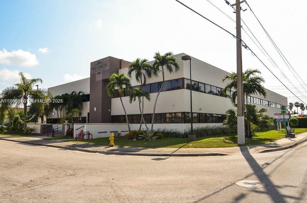 A two-story commercial office building with palm trees and a parking lot in front — 5600 SW 135th Ave, Miami FL 33183, MIAMI, FL