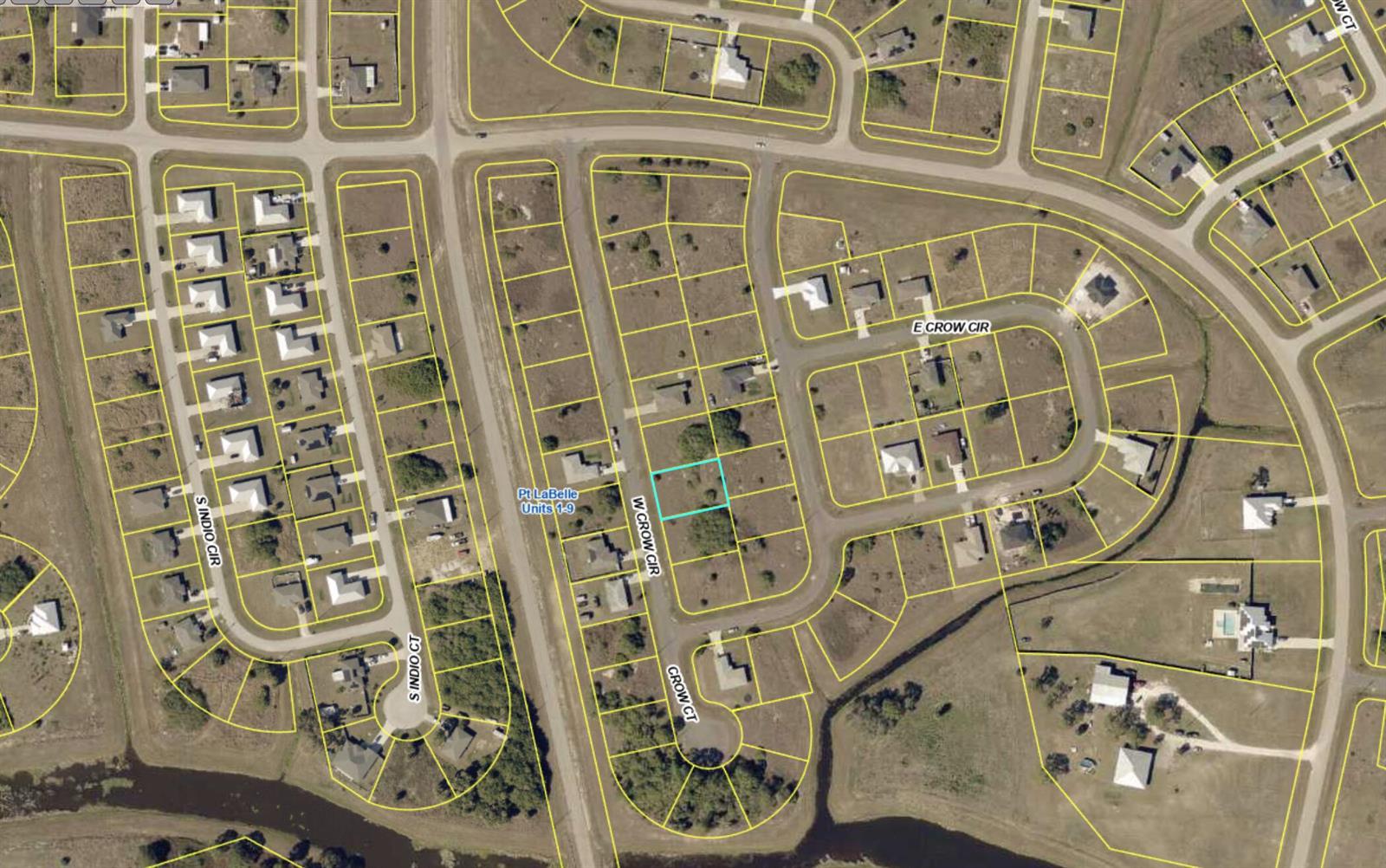 This is an aerial map showing a vacant residential lot highlighted in a suburban neighborhood — 9014 W Crow Circle, FL 33935, FL