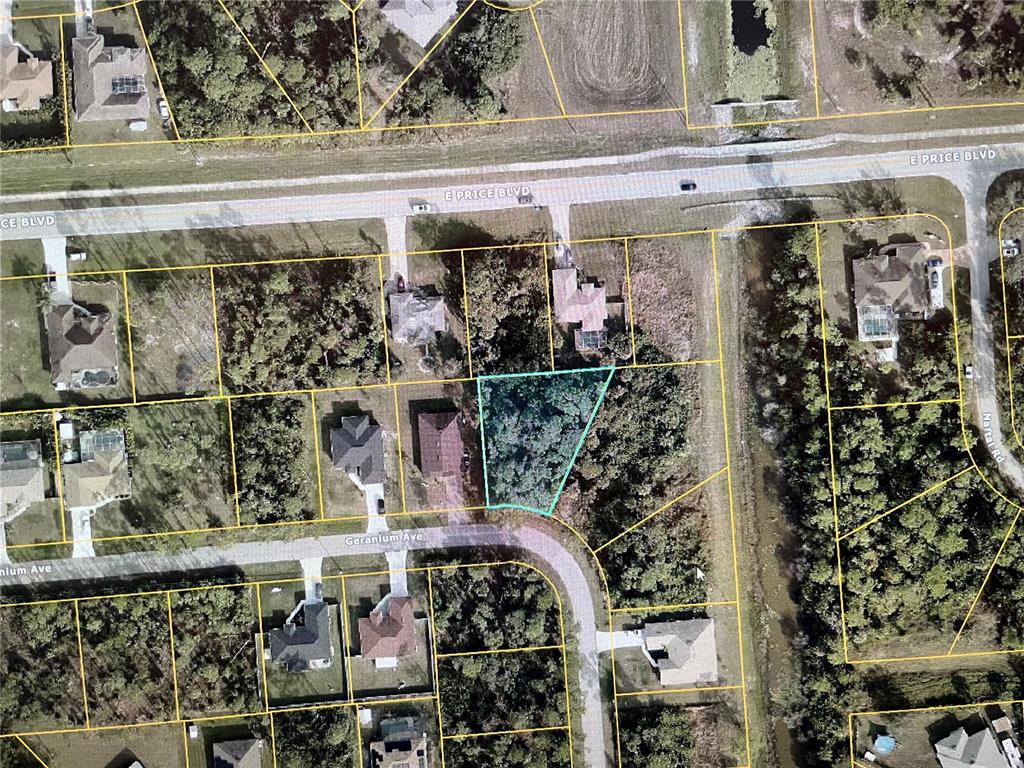 This is an aerial map showing a vacant lot highlighted in blue within a residential neighborhood — LOT 20 GERANIUM AVENUE, NORTH PORT, FL