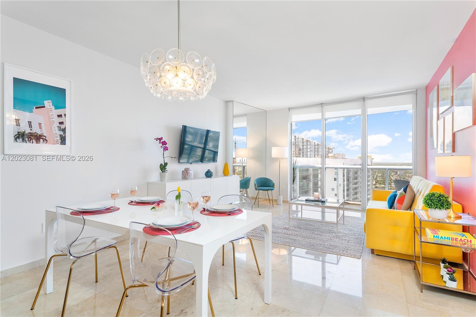 A bright living and dining area features a yellow sofa, white table, and floor-to-ceiling windows — 485 Brickell Ave # 4206, Miami FL 33131, MIAMI, FL