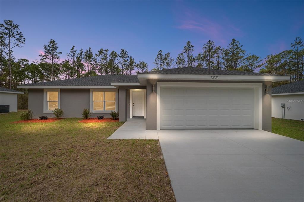 This is a floor plan for a three-bedroom, two-bathroom house with an attached garage — 24272 NW ASPEN LANE, DUNNELLON, FL