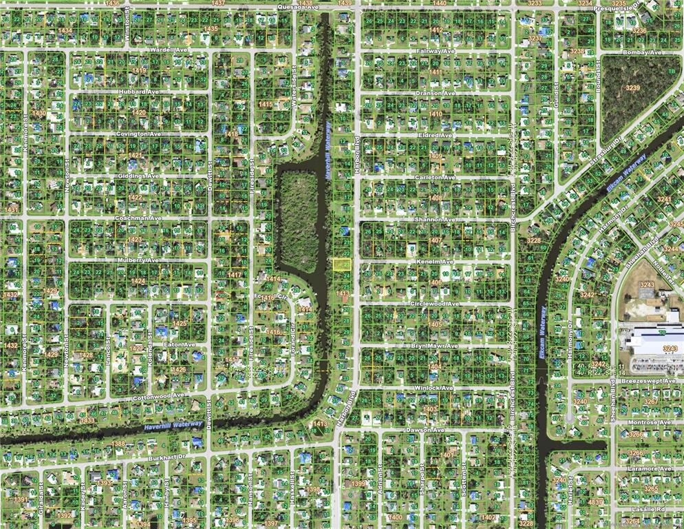 This is a satellite map view of a residential neighborhood with streets and waterways — 1457 HARBOR BOULEVARD, PORT CHARLOTTE, FL