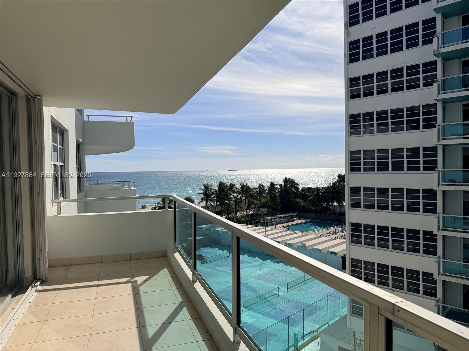 A balcony overlooks a tennis court, a swimming pool, palm trees, and the ocean — 5151 Collins Ave, Miami Beach FL 33140, MIAMI BEACH, FL