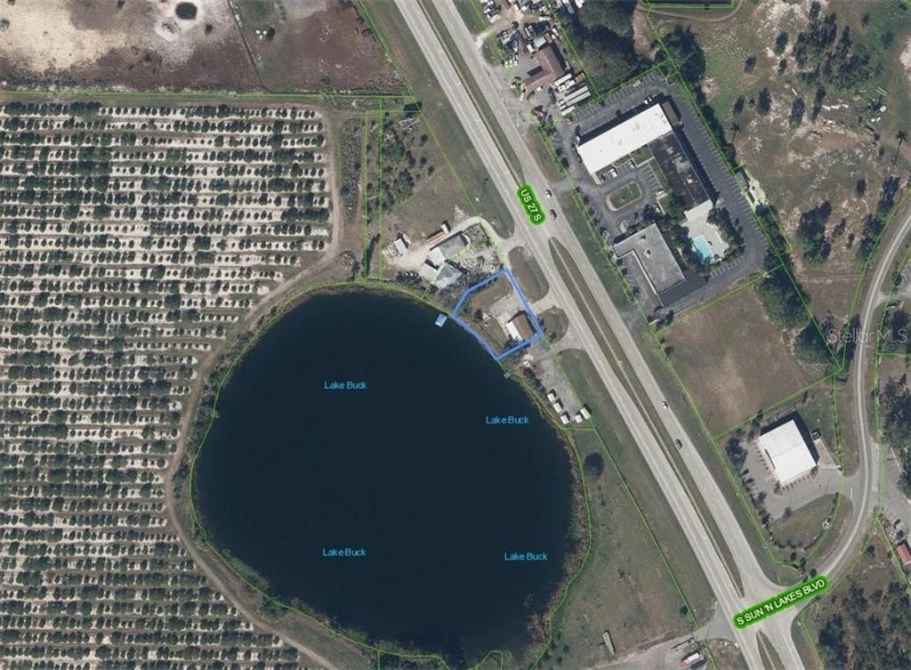 This aerial map shows a property lot outlined in blue next to Lake Buck — 2200 - 2204 US 27 HIGHWAY S, LAKE PLACID, FL