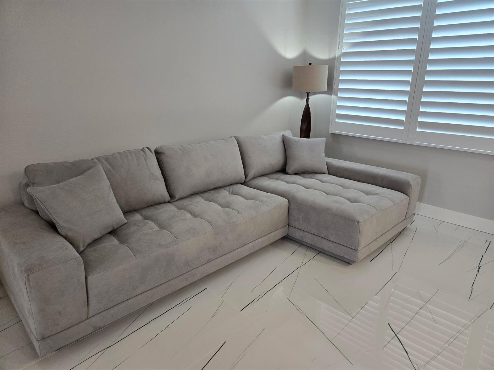 A light gray sectional sofa sits on a white marble floor in a living room — 201 N Ocean Boulevard # 410, Pompano Beach FL 33062, POMPANO BEACH, FL