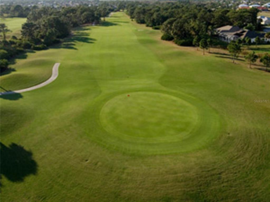 An aerial view of a golf course fairway leading toward a green — 1151 BOUNDARY BOULEVARD, ROTONDA WEST, FL