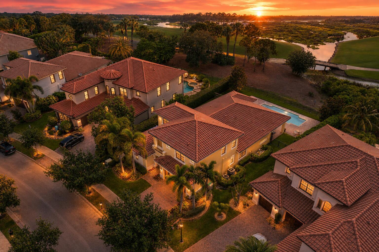 An aerial view of several Mediterranean-style houses with tile roofs, swimming pools, and landscaped yards — 8152 Bradford Way, Parkland FL 33076, PARKLAND, FL
