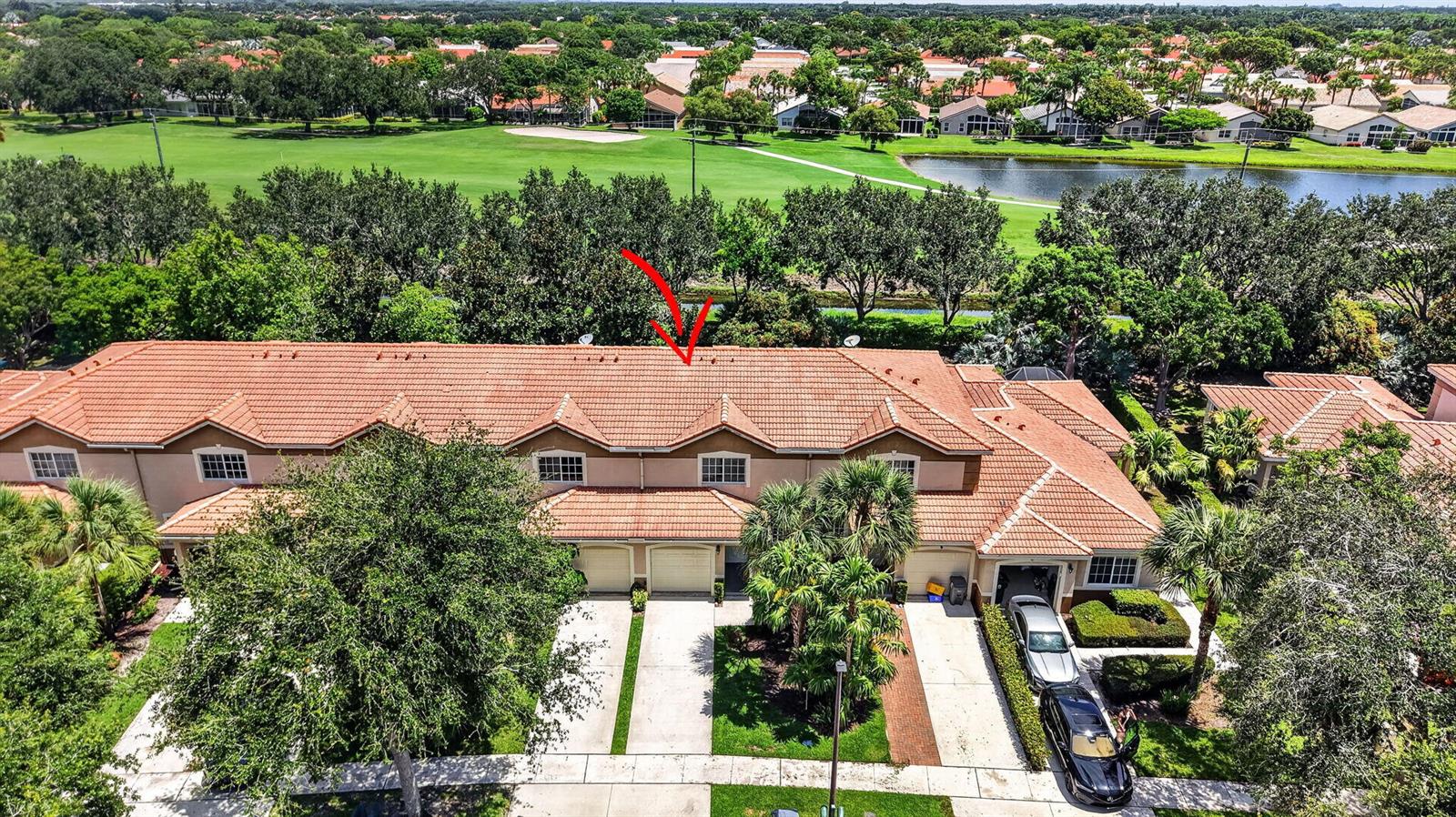An aerial view of a multi-unit townhouse complex with a red tile roof and garages — 6689 Old Farm Trail, Boynton Beach FL 33437, BOYNTON BEACH, FL