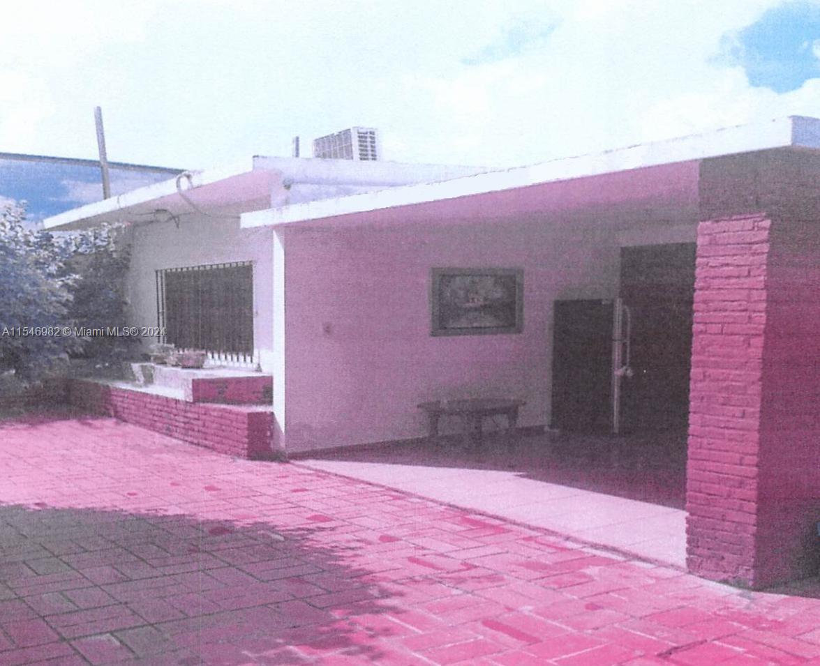 A single-story house features a red brick patio, a covered porch, and a brick pillar — 66-B ARROYO HONDO VIEJO DN, 0 0, 0