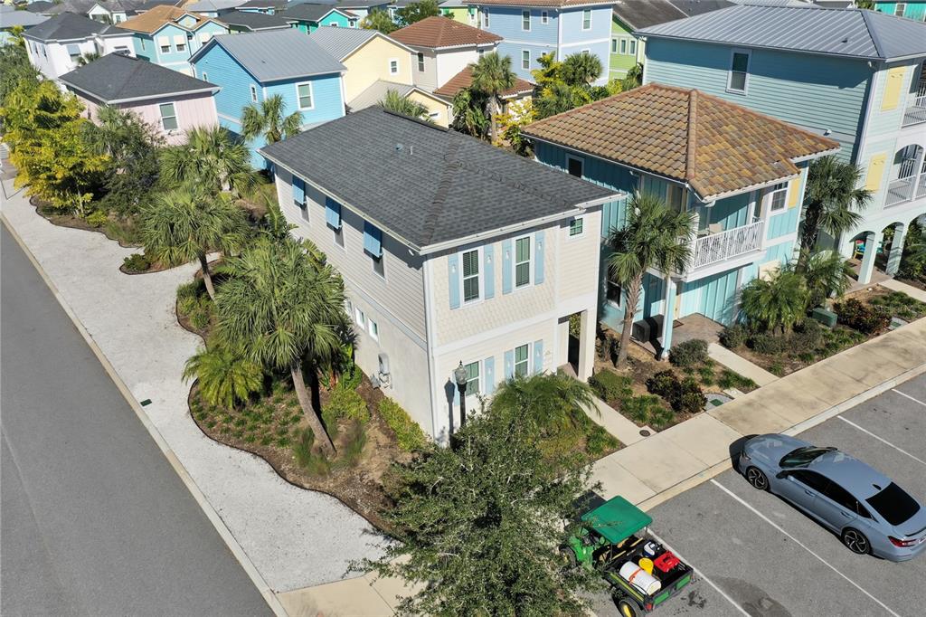 An aerial view shows a two-story house with light siding and a dark roof — 2972 SALTED RIM ROAD, KISSIMMEE, FL