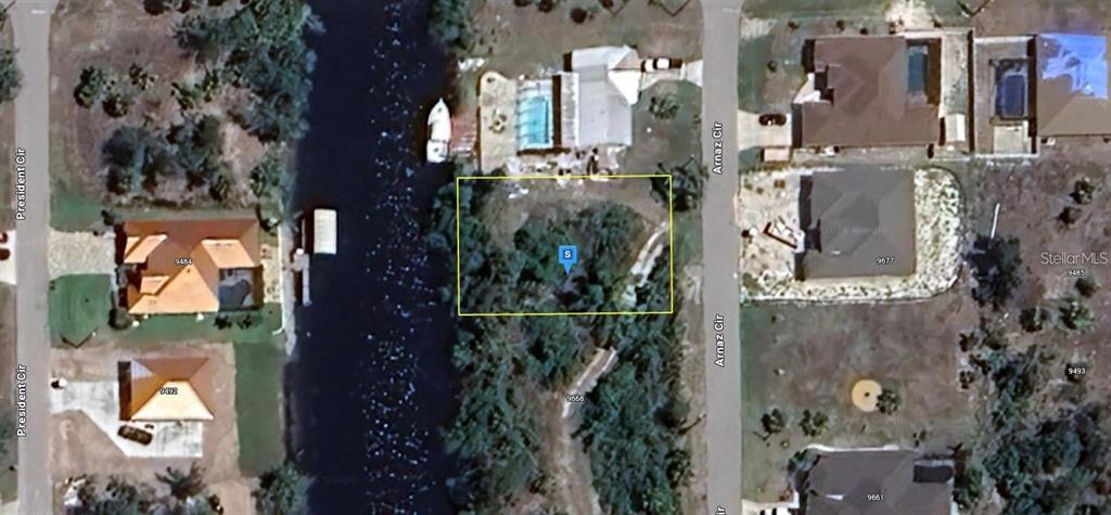 This is an aerial map view of a vacant, wooded residential lot — 9676 ARNAZ CIRCLE, PORT CHARLOTTE, FL