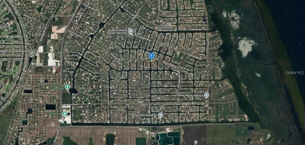 This is an aerial map view of a residential neighborhood with canal-front properties — 9676 ARNAZ CIRCLE, PORT CHARLOTTE, FL