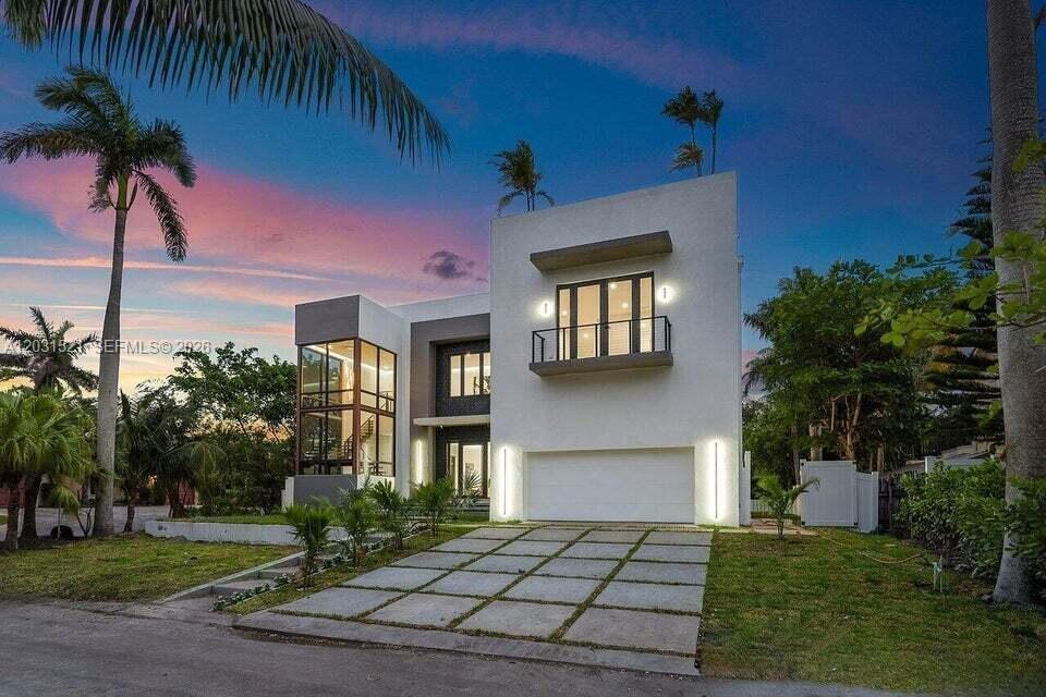 A modern two-story house with a white facade, glass-walled staircase, and a concrete driveway — 638 Lakeside Harbor, Boynton Beach FL 33435, BOYNTON BEACH, FL