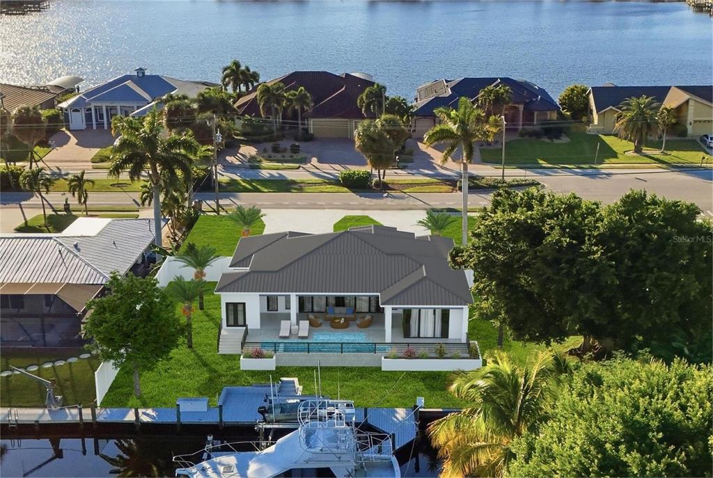 This is a digital rendering of a waterfront house with a pool and boat dock — 5229 PELICAN BOULEVARD, CAPE CORAL, FL