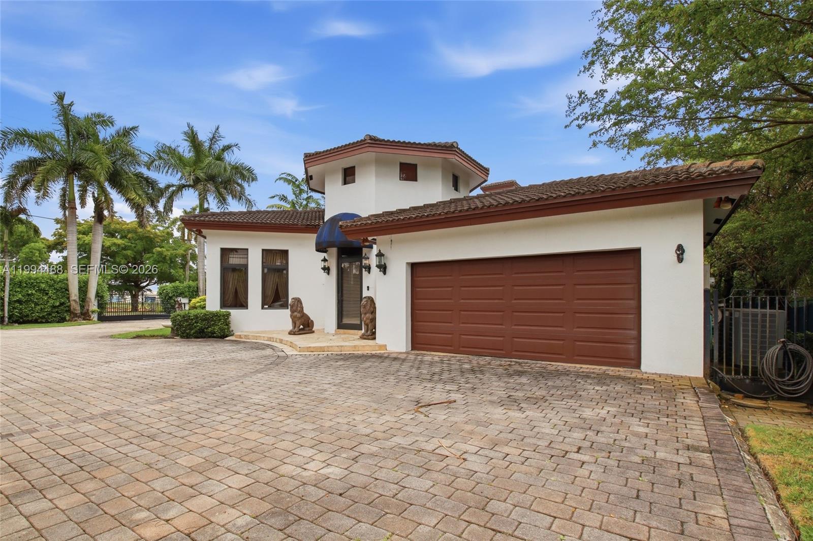 A white house with a brown tile roof, a two-car garage, and a paved driveway — 6200 SW 97th Ave, Miami FL 33173, MIAMI, FL