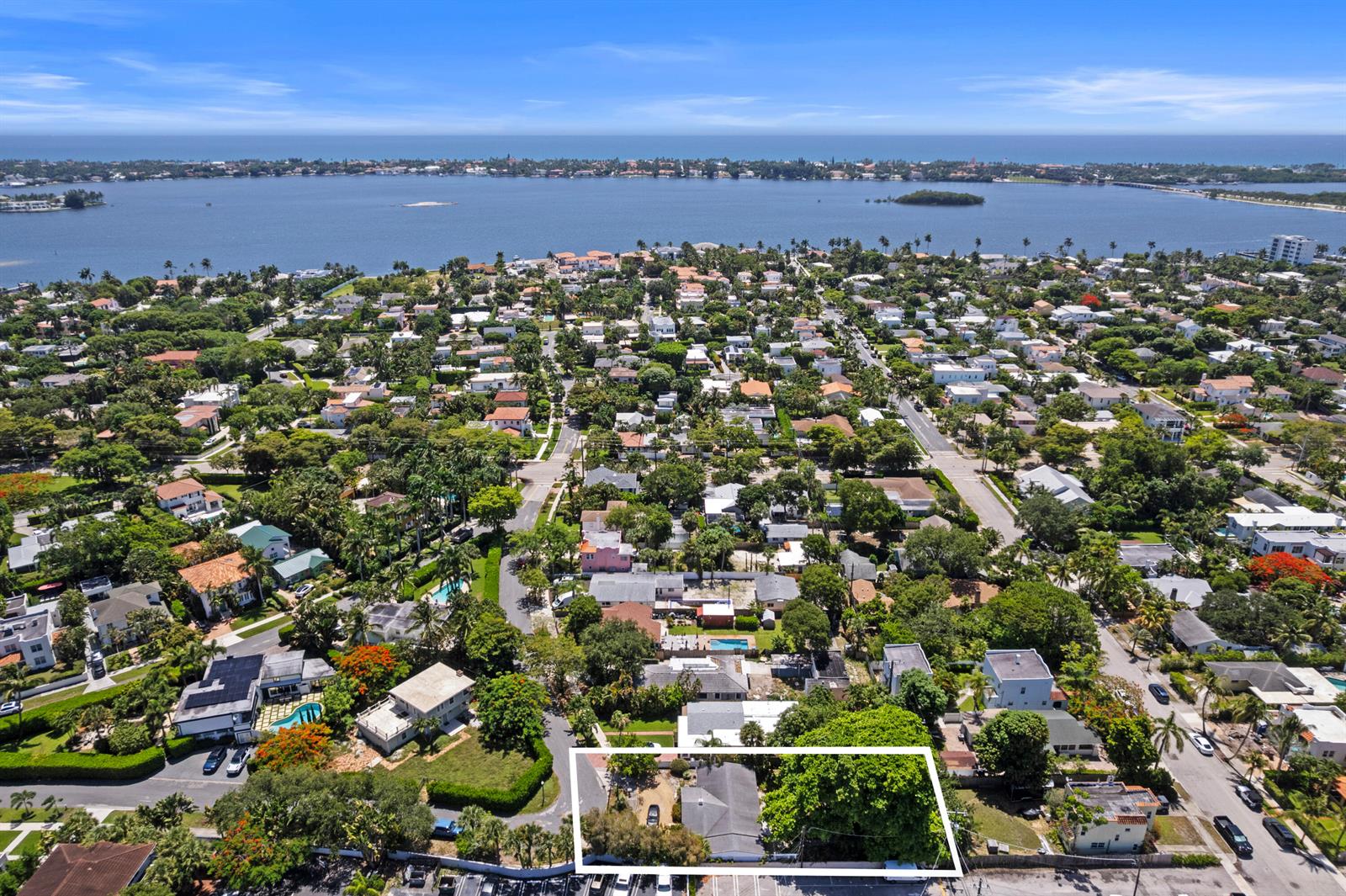 An aerial view shows a residential property highlighted by a white border near the water — 330 Marlborough Place, West Palm Beach FL 33405, WEST PALM BEACH, FL