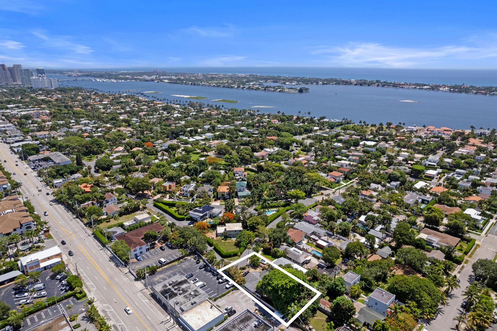 An aerial view shows a residential lot outlined in white next to a commercial parking area — 330 Marlborough Place, West Palm Beach FL 33405, WEST PALM BEACH, FL