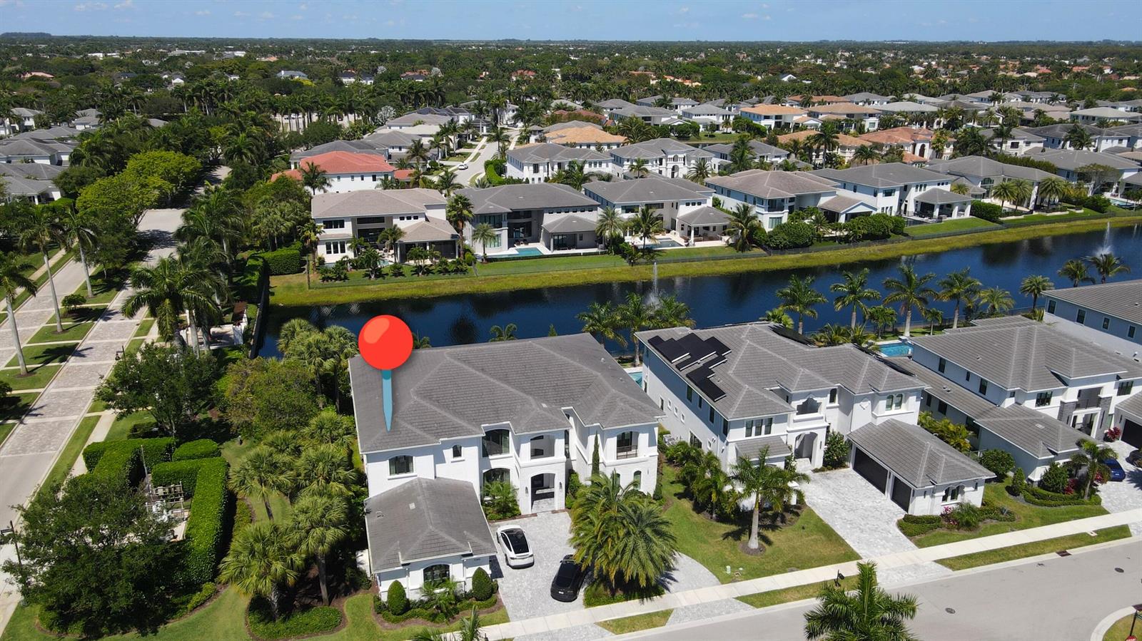 An aerial view shows a large white house with a gray roof and a red pin — 7080 NW 26th Way, Boca Raton FL 33496, BOCA RATON, FL
