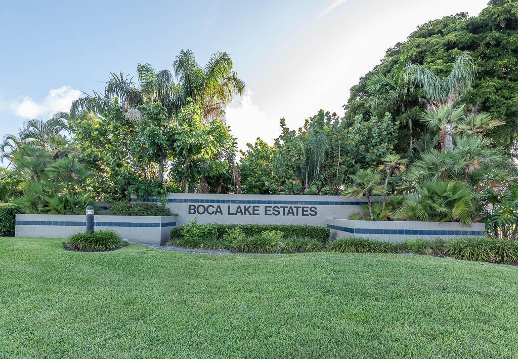 A stone sign reading Boca Lake Estates sits in front of lush tropical landscaping — 251 NW 69th Street, Boca Raton FL 33487, BOCA RATON, FL