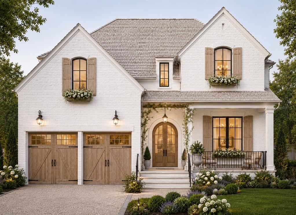 A two-story white brick house with a gravel driveway, wooden garage doors, and arched entryway — 4608 W EL PRADO BOULEVARD, TAMPA, FL