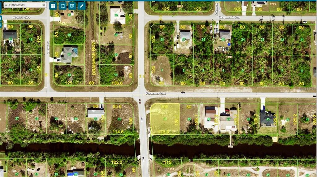 This is a satellite map showing residential land parcels and streets in a suburban neighborhood — 12743 FORESMAN BLVD, PORT CHARLOTTE, FL