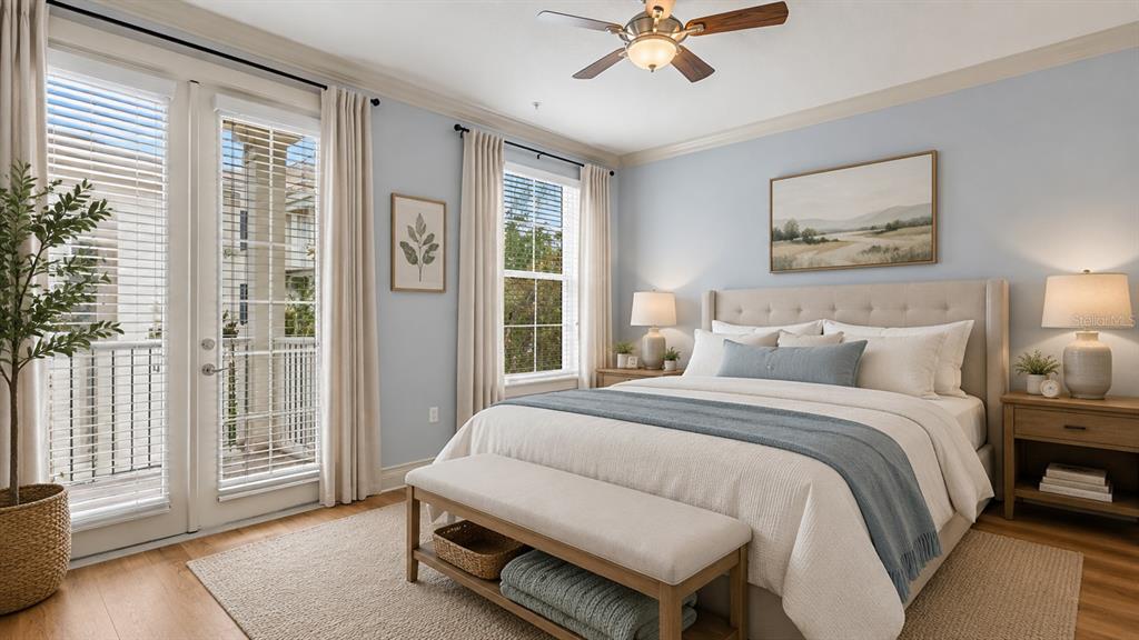 A bedroom features a king bed, a bench, two nightstands, and a balcony with doors — 4286 ANISSA AVENUE UNIT 10-202, ORLANDO, FL