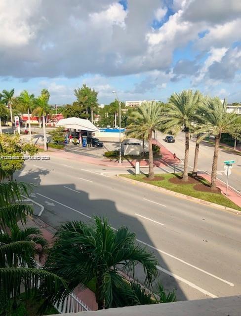 An elevated view shows a gas station, palm trees, and a multi-lane road — 2000 Biarritz Dr # 407, Miami Beach FL 33141, MIAMI BEACH, FL