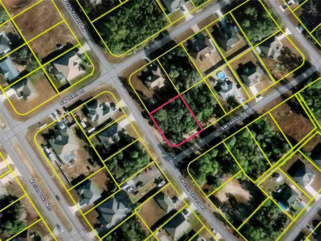 This is an aerial map showing a vacant lot outlined in pink within a residential neighborhood — LOT 10 SW 27TH TERRACE ROAD, OCALA, FL