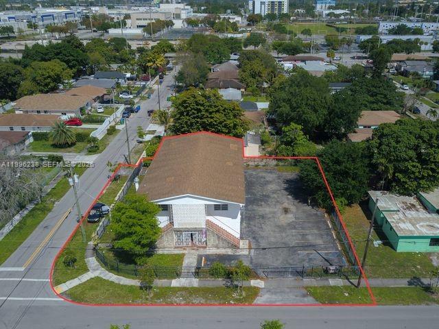 An aerial view shows a two-story building with a parking lot outlined in red — 6891 NW 13th Ave, Miami FL 33147, MIAMI, FL