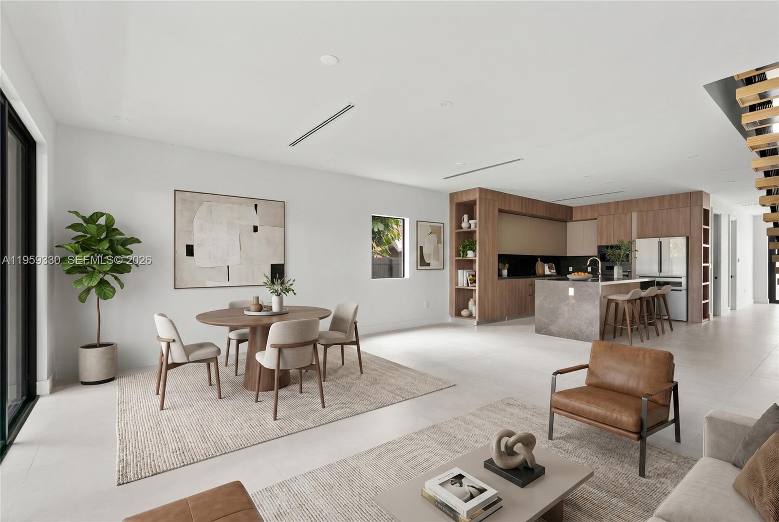 An open-concept living and dining area features light tile floors, wood cabinetry, and modern furniture — 1431 SW 20th St, Miami FL 33145, MIAMI, FL