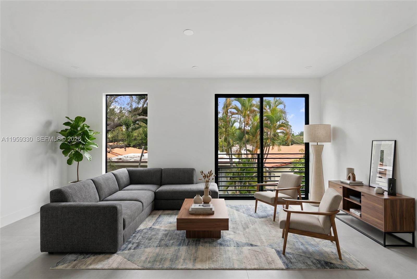 A modern living room features a gray sectional sofa, two armchairs, and a wooden coffee table — 1431 SW 20th St, Miami FL 33145, MIAMI, FL