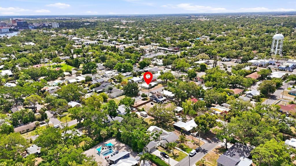 This aerial view shows a residential neighborhood with a red pin marking a specific house — 301 28TH STREET W, BRADENTON, FL