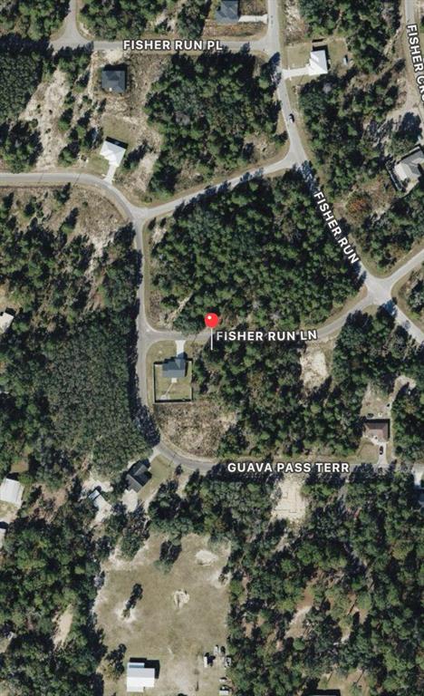 This is an aerial map view showing a residential street with wooded lots and houses — 22 FISHER RUN LANE, OCKLAWAHA, FL