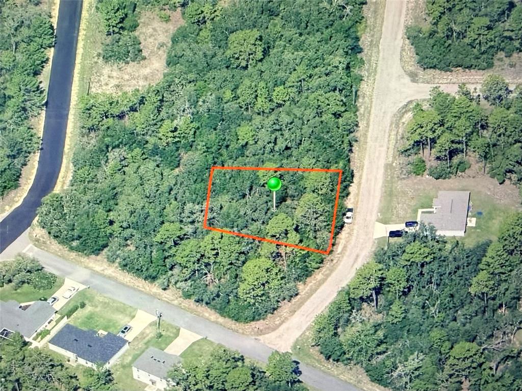 An aerial view shows a rectangular, wooded vacant lot marked with a green pin — 3270 W YARDLEY LANE, DUNNELLON, FL