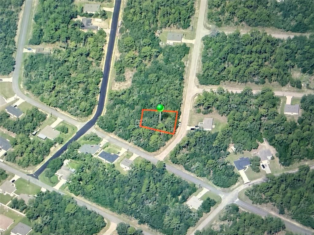 An aerial view shows a rectangular, wooded vacant lot outlined in red with a marker — 3270 W YARDLEY LANE, DUNNELLON, FL