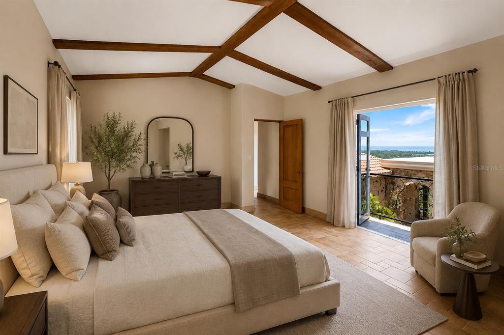 A bedroom with wood ceiling beams, a balcony, and a view of the ocean — Carr 100 km 2.7 BO. GUANAJIBO, CABO ROJO, PR