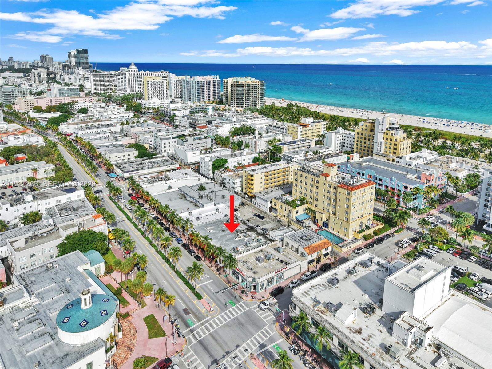 An aerial view shows a commercial building with a red arrow pointing to its roof — 1323 Washington Ave, Miami Beach FL 33139, MIAMI BEACH, FL